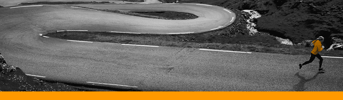 A woman running on a curving road